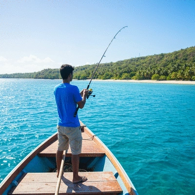 Tropical saltwater fishing scene with a person holding a fishing rod on a boat, clear blue water, sunny weather, no text, no words, no typography, clean image